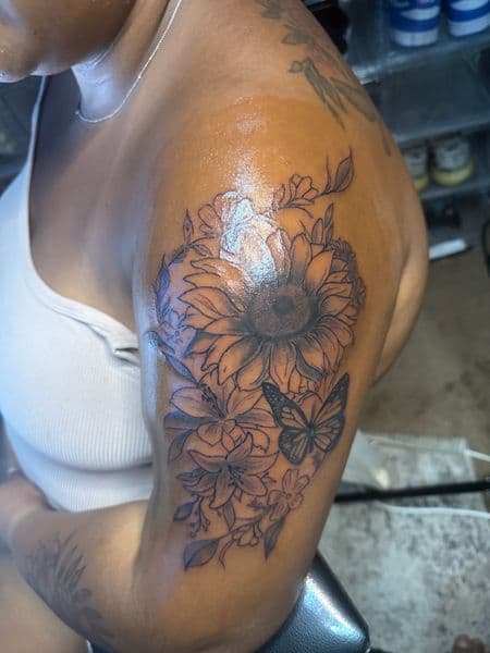 Floral + Black & Grey sunflower tattoo on Upper Arm by Overall_Ink on TattMe
