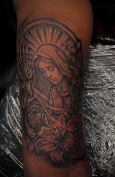 Black & Grey + Illustrative virgin mary tattoo on Upper Arm by Marco_KingsB on TattMe