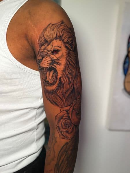 Realism + Black & Grey lion tattoo on Upper Arm by ClaudThaCreeator on TattMe