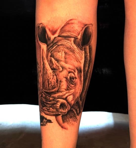 Black & Grey + Realism rhinoceros tattoo on Calf by InkByWayne on TattMe