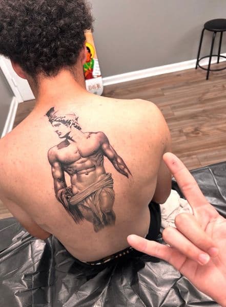 Black & Grey + Realism man tattoo on Upper Back by Jinx on TattMe