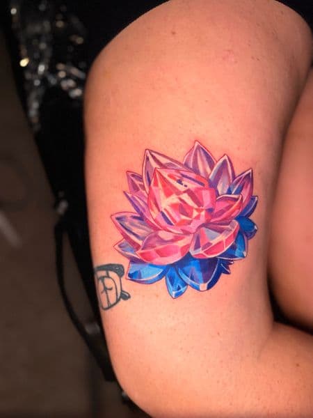Color + Illustrative lotus tattoo on Thigh by Kiwi on TattMe