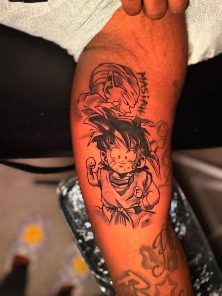 Anime + Black & Grey goku tattoo on Upper Arm by Kiwi on TattMe