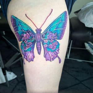 Color + Illustrative butterfly tattoo on Thigh by Kiwi on TattMe
