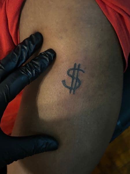 Minimalist + Black-work dollar sign tattoo on Upper Arm by tatsbyNunu on TattMe