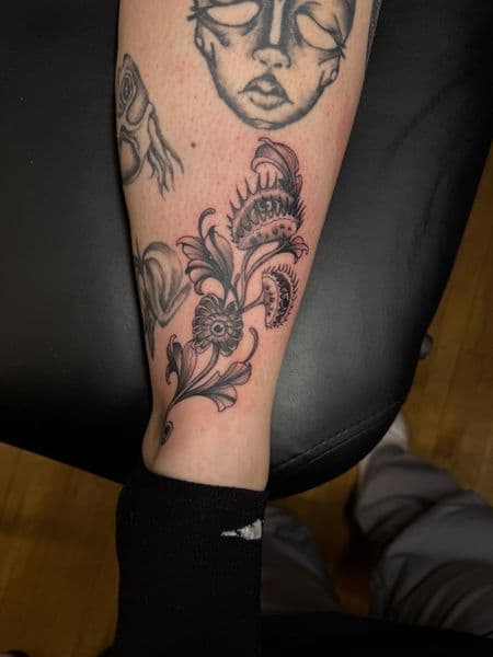 Black & Grey + Illustrative venus flytrap tattoo on Shin by InkedbyJunior on TattMe