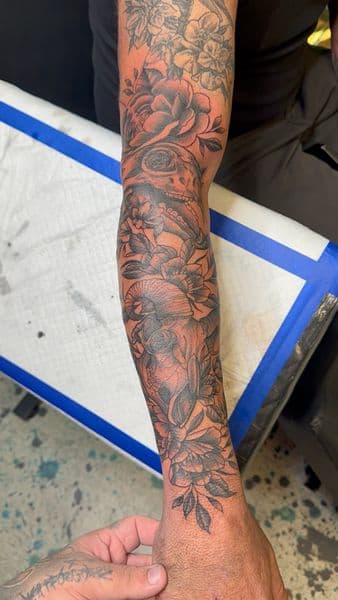 Black & Grey + Illustrative flowers tattoo on Forearm by InkedbyJunior on TattMe