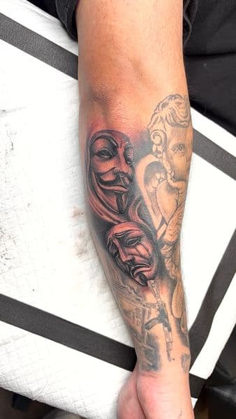 Black & Grey + Realism masks tattoo on Forearm by InkedbyJunior on TattMe