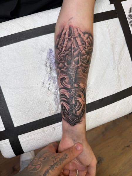 Black & Grey + Illustrative trident tattoo on Forearm by InkedbyJunior on TattMe