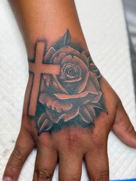 Black & Grey + Illustrative cross tattoo on Hand by InkedbyJunior on TattMe