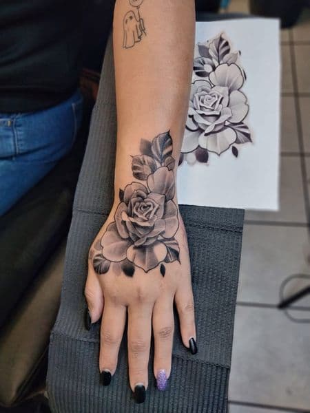 Black & Grey + Floral roses tattoo on Hand by ggtat2z_1487 on TattMe