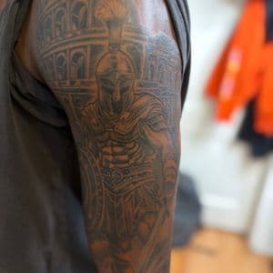 Black & Grey + Illustrative warrior tattoo on Upper Arm by tattoogoonz on TattMe