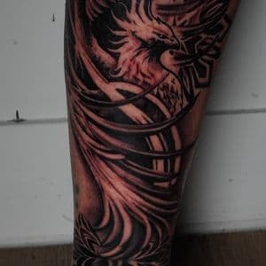Surrealism + Black & Grey pheonix tattoo on Shin by TATMANERC on TattMe