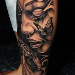 Surrealism + Black & Grey face tattoo on Calf by TATMANERC on TattMe