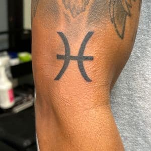 Black-work + Minimalist pisces tattoo on Upper Arm by ink_by_trainwreck on TattMe