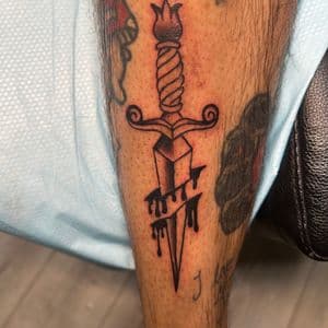 Traditional + Black-work dagger tattoo on Calf by ink_by_trainwreck on TattMe