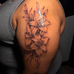 Floral + Fine Line flowers tattoo on Upper Arm by tattoo.banditt on TattMe