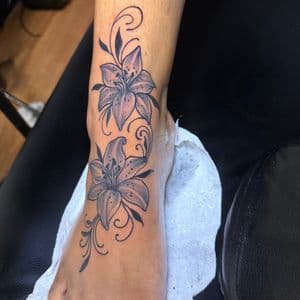 Black & Grey + Floral lilies tattoo on Ankle by TaeDavinci on TattMe