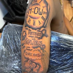 Black & Grey + Lettering clock tattoo on Upper Arm by TaeDavinci on TattMe