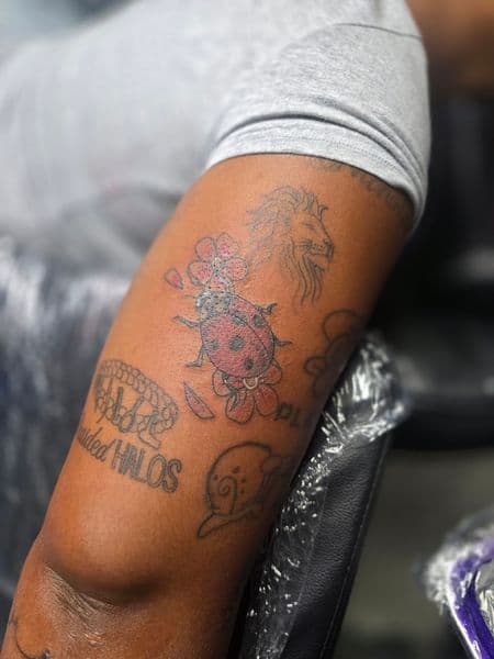 Color + Line-work ladybug tattoo on Upper Arm by Qjoriginals43 on TattMe