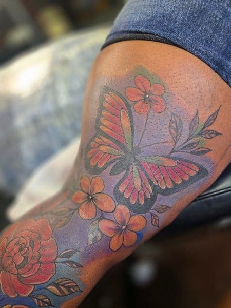 Color + Floral butterfly tattoo on Full Leg Sleeve by Qjoriginals43 on TattMe