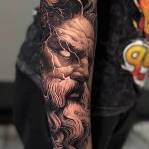 Realism + Black & Grey zeus tattoo on Forearm by Sixteenth_Studio on TattMe