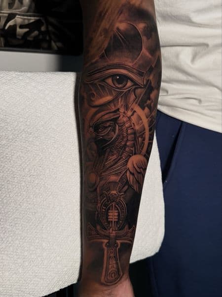 Black & Grey + Illustrative eye of horus tattoo on Forearm by D-Artist on TattMe