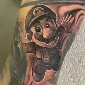 Black & Grey + Pop Culture mario tattoo on Upper Arm by D-Artist on TattMe