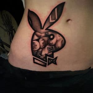 Black & Grey + Illustrative playboy bunny tattoo on Ribs by D-Artist on TattMe