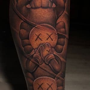 Pop Culture + Black & Grey kaws tattoo on Calf by D-Artist on TattMe