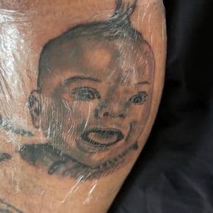 Black & Grey + Portrait Realism baby tattoo on Calf by gq_ink on TattMe