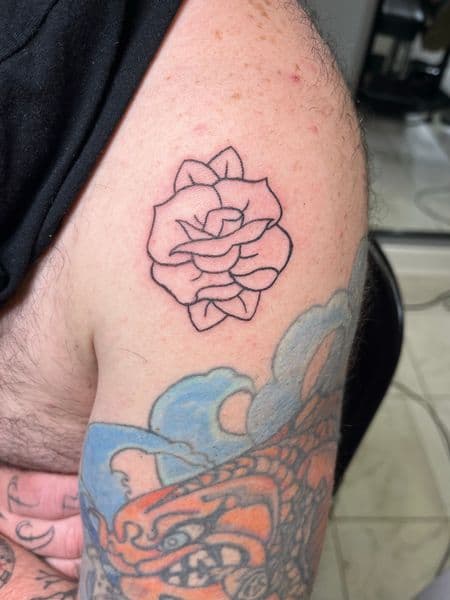 Fine Line + Floral rose tattoo on Upper Arm by inksfromkels on TattMe