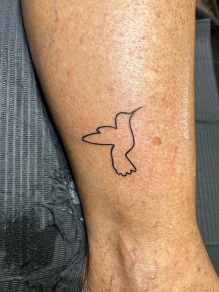 Fine Line + Minimalist hummingbird tattoo on Ankle by inksfromkels on TattMe
