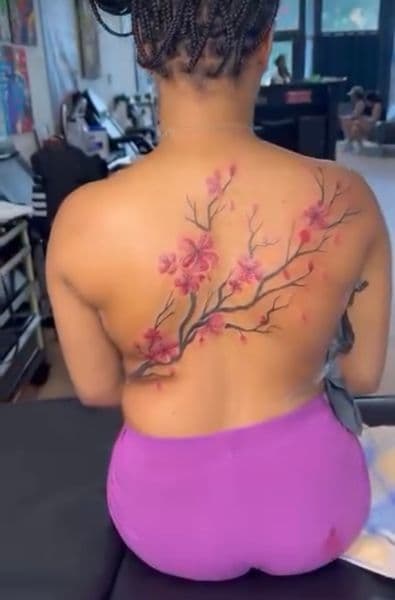 Floral + Color cherry blossoms tattoo on Upper Back by teeskiink on TattMe