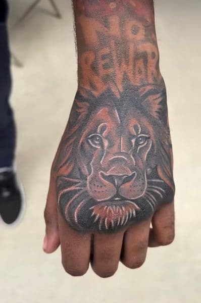 Black & Grey + Realism lion tattoo on Hand by teeskiink on TattMe