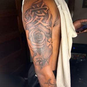 Black & Grey + Illustrative rose tattoo on Upper Arm by teeskiink on TattMe