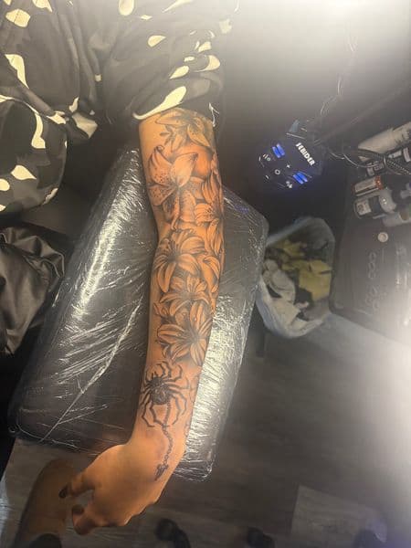 Black & Grey + Illustrative lilies tattoo on Forearm by teeskiink on TattMe