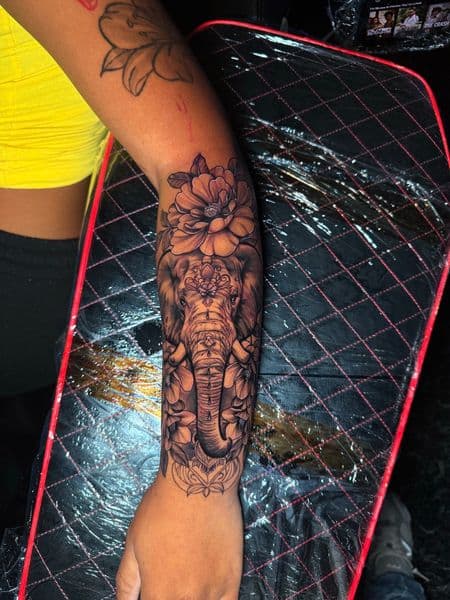 Black & Grey + Illustrative elephant tattoo on Forearm by nayasTats on TattMe