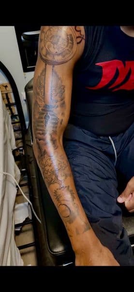 Realism + Anime black and grey anime sleeve tattoo by Inkbykey_ on TattMe