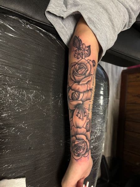 Black & Grey + Floral roses tattoo on Forearm by TatsByDaVinci on TattMe