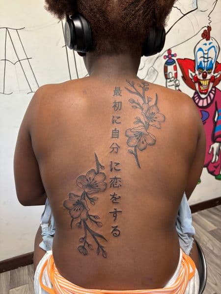 Floral + Fine Line flowers tattoo on Upper Back by TatsByDaVinci on TattMe