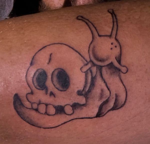 Black & Grey + Illustrative snail tattoo on Upper Arm by erika.main.ave on TattMe