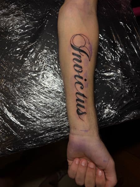 Lettering + Script invictus tattoo on Forearm by erika.main.ave on TattMe