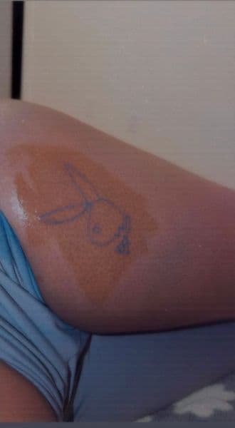 Line-work + Minimalist playboy bunny tattoo on Thigh by Inkk_ByYanna on TattMe