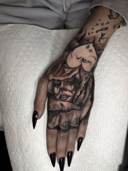 Chicano + Black & Grey clown tattoo on Hand by inkryptd on TattMe