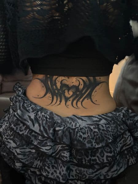 Black-work + Tribal heart tattoo on Lower Back by inkryptd on TattMe