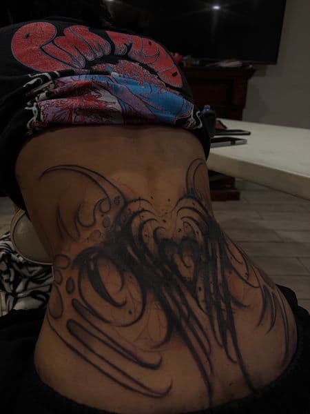 Black-work + Tribal abstract tattoo on Lower Back by inkryptd on TattMe