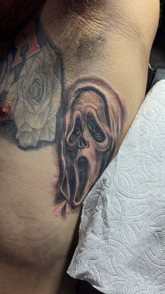 Black & Grey + Realism ghostface tattoo on Ribs by inkryptd on TattMe