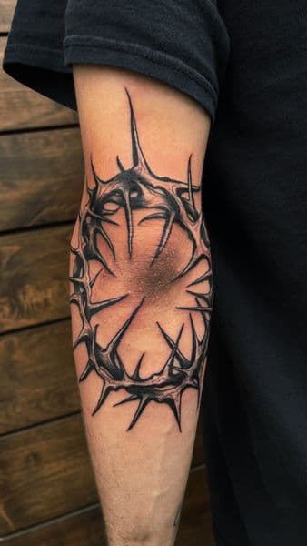 Black & Grey + Illustrative crown of thorns tattoo on Elbow by inkryptd on TattMe