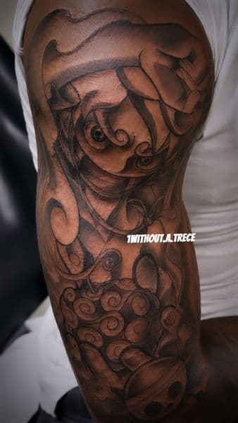 Black & Grey + Illustrative clouds tattoo on Upper Arm by without.a.trece on TattMe